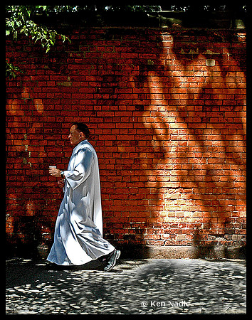 Priest in shadows and light