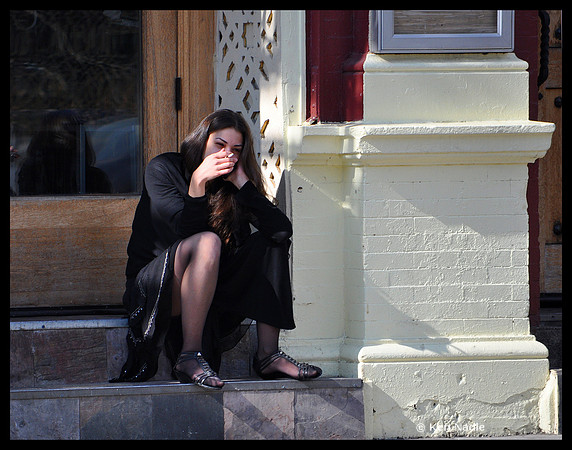 Woman on steps smoking